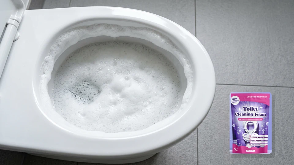 Expanding thick white foam layer covering toilet bowl water surface beside authorized Fizzclean product pouch